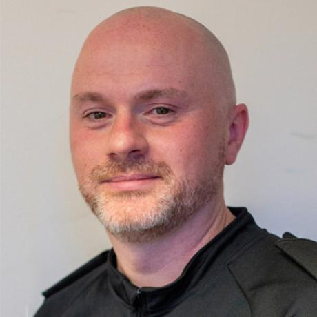 A headshot of the author, Chris Mckee